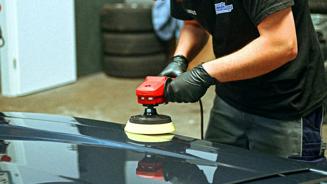 Car being machine polished in a detailing studio